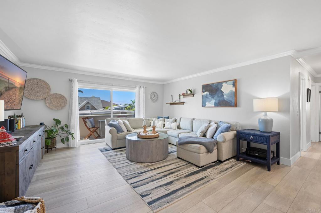 528 E Avenue Coronado, CA 92118 - Photo 7 of 19 a living room with furniture and a wooden floor