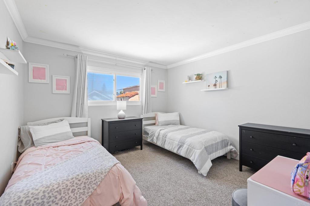 528 E Avenue Coronado, CA 92118 - Photo 9 of 19 a bedroom with a bed and a couch