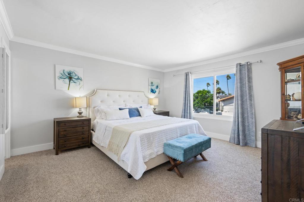 528 E Avenue Coronado, CA 92118 - Photo 10 of 19 a bed sitting in a bedroom next to a window