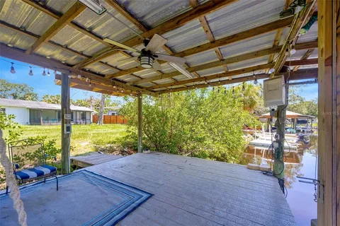 a view of a porch with wooden floor