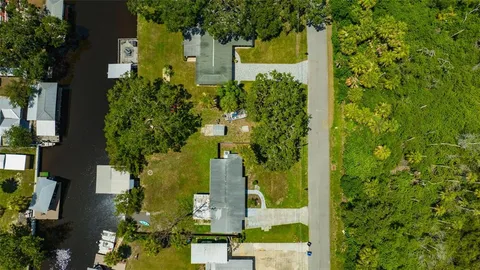 an aerial view of residential house with an outdoor space