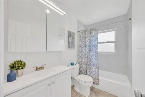 a bathroom with a sink a toilet and a bathtub