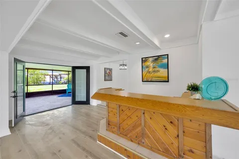 a spacious bedroom with a bed and a dresser