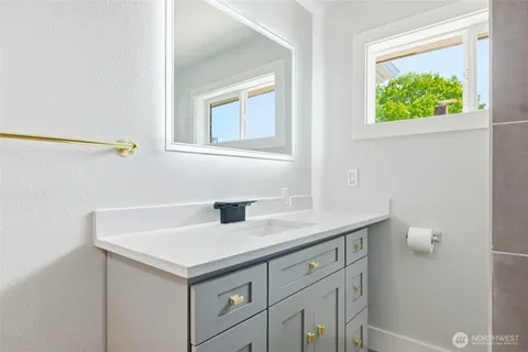 a bathroom with a sink and a mirror