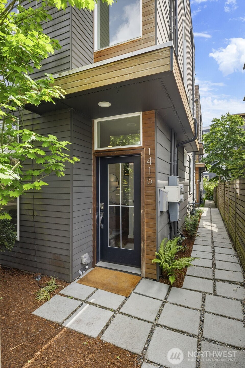 1415 East Fir Street Seattle, WA 98122 - Photo 2 of 34 a view of a brick house with a large windows