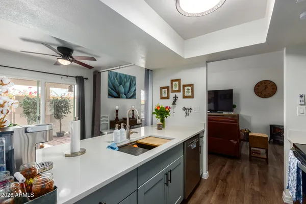 a kitchen with stainless steel appliances a stove a sink and a refrigerator