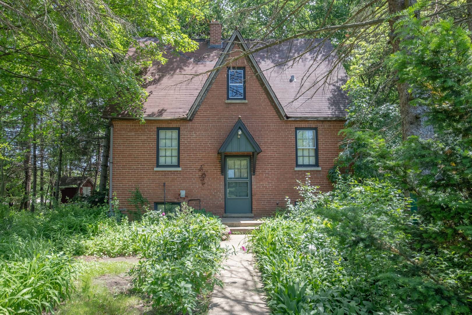 front view of a house with a small yard
