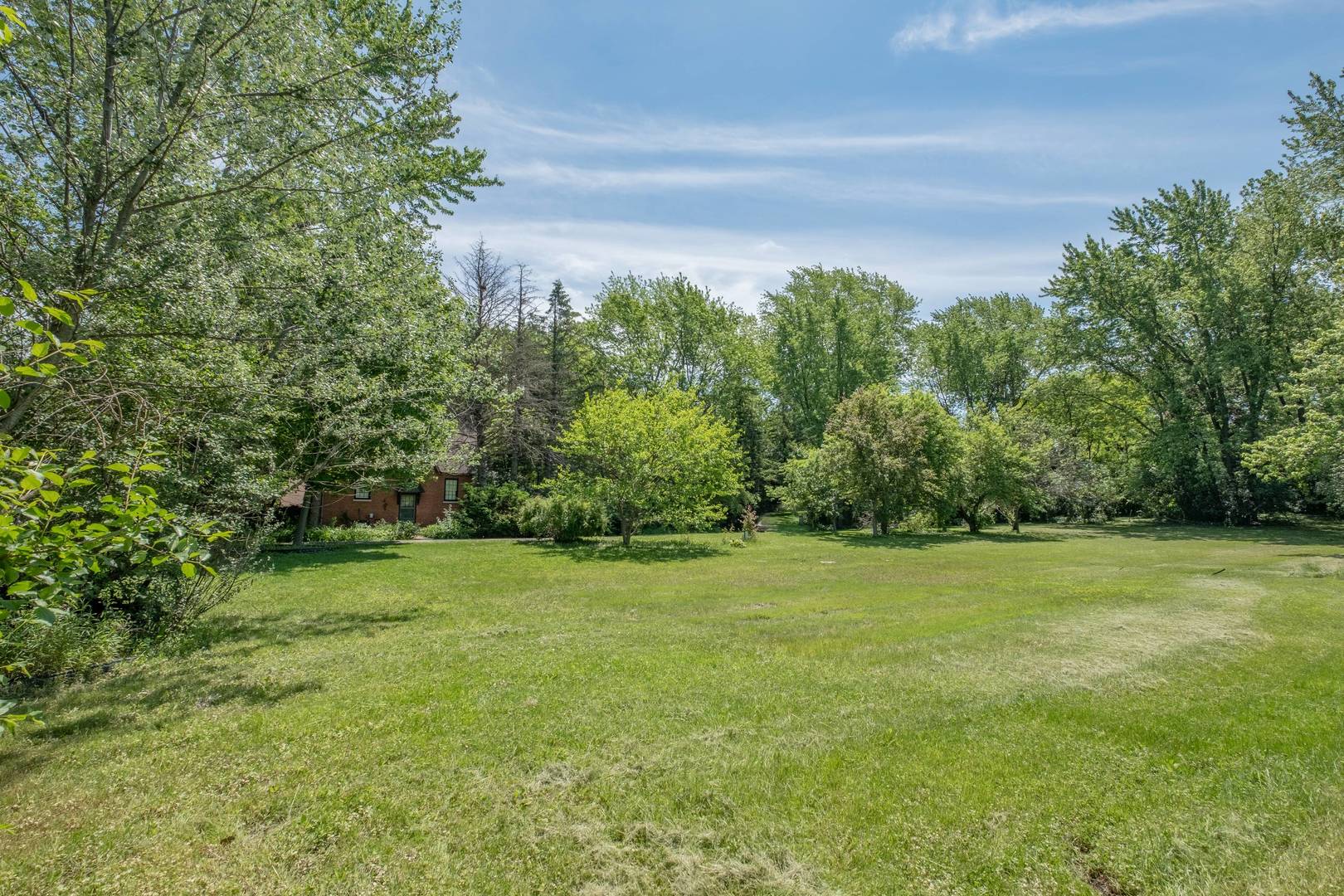 2331 West Palatine Road Palatine, IL 60067 - Photo 6 of 19 a view of a field with trees in the background