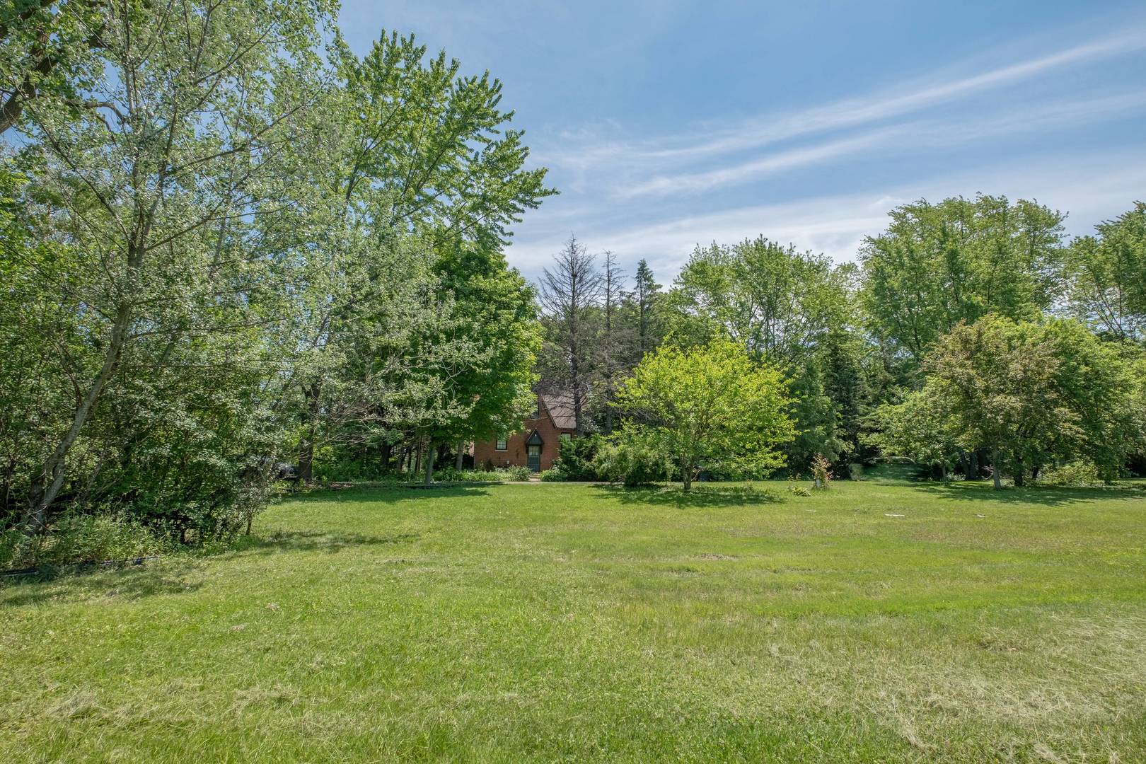 2331 West Palatine Road Palatine, IL 60067 - Photo 7 of 19 a view of a green field with trees in the background