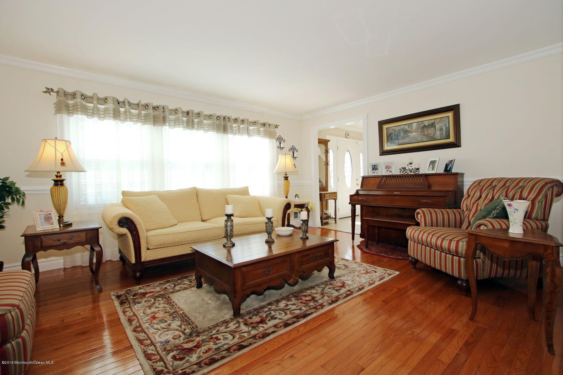 4 Fern Road Farmingdale, NJ 07727 - Photo 6 of 33 a living room with furniture and a wooden floor