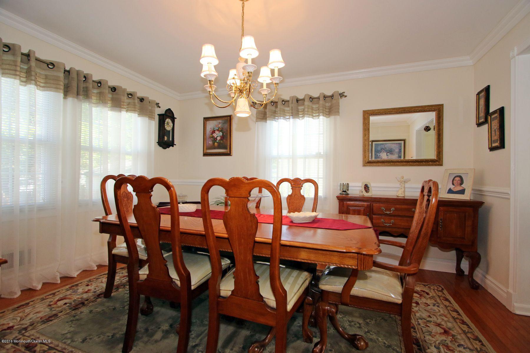 4 Fern Road Farmingdale, NJ 07727 - Photo 8 of 33 a view of a dining room with furniture and chandelier