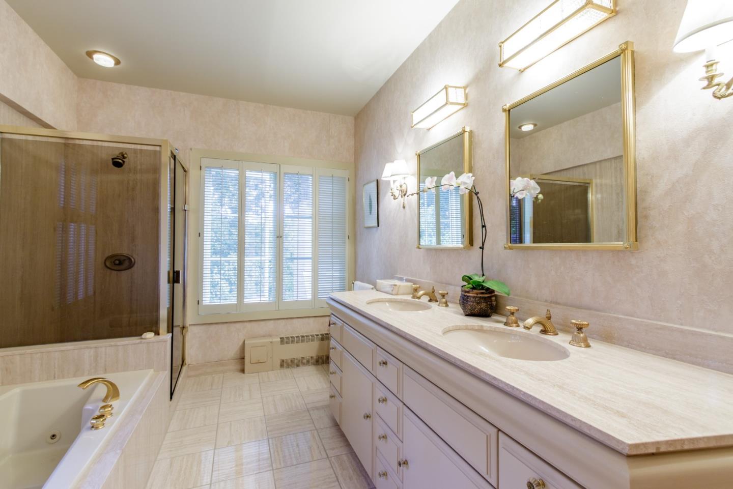 290 Richmond Road Hillsborough, CA 94010 - Photo 11 of 24 a spacious bathroom with a granite countertop tub sink a mirror a vanity and next to a window