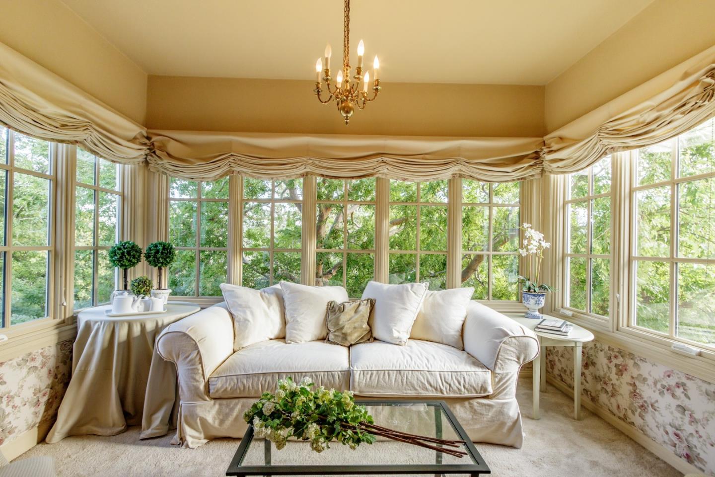 290 Richmond Road Hillsborough, CA 94010 - Photo 12 of 24 a living room with furniture and a chandelier