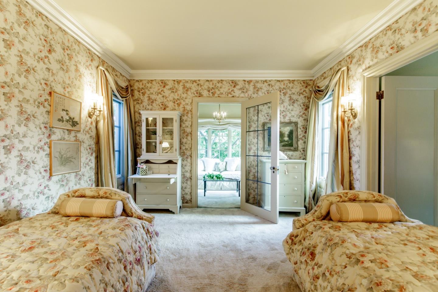 290 Richmond Road Hillsborough, CA 94010 - Photo 15 of 24 a bedroom with a large bed and a large window