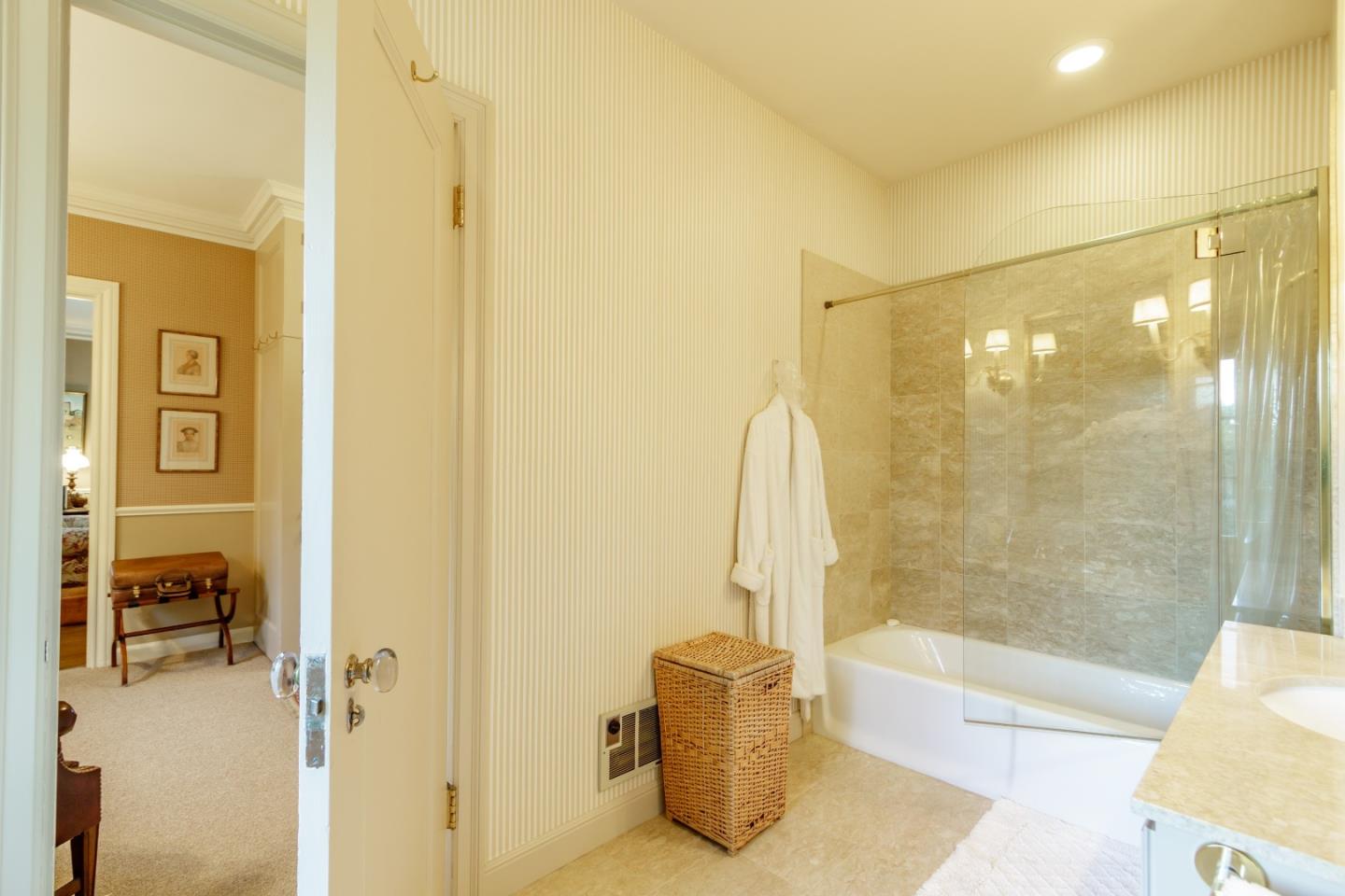 290 Richmond Road Hillsborough, CA 94010 - Photo 16 of 24 a bathroom with a bathtub and a shower