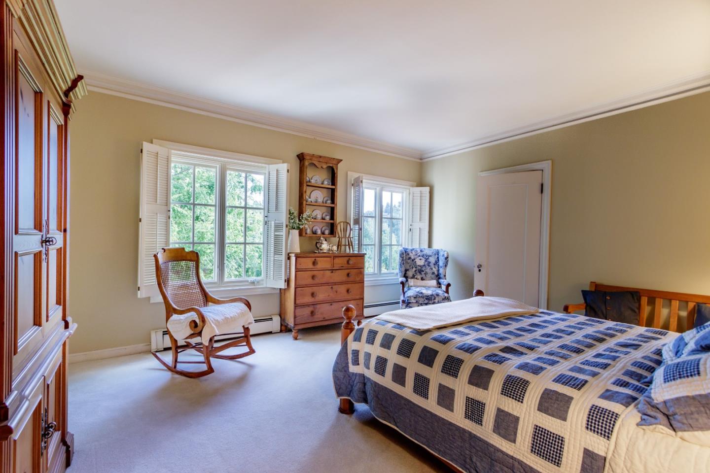 290 Richmond Road Hillsborough, CA 94010 - Photo 17 of 24 a bedroom with a bed a chair and next to a window