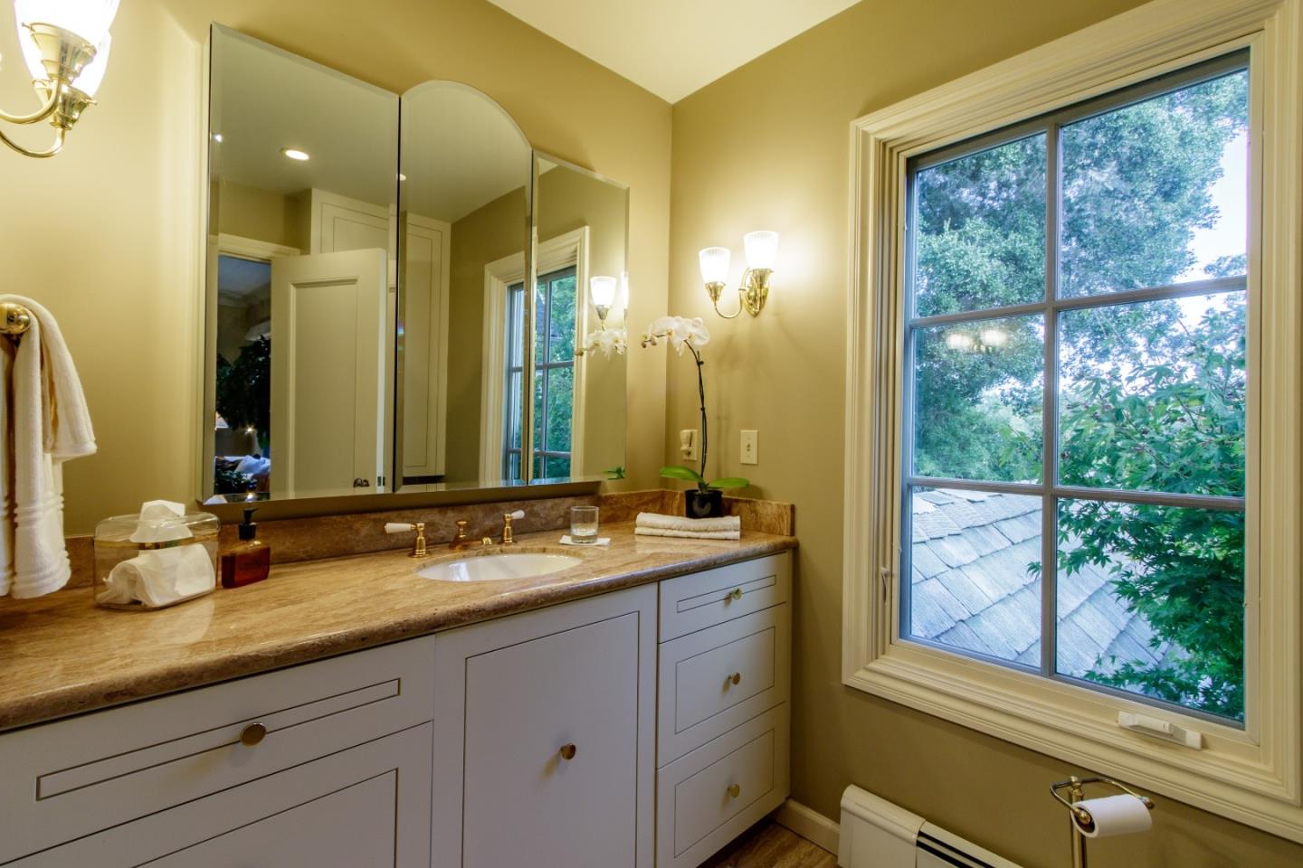 290 Richmond Road Hillsborough, CA 94010 - Photo 18 of 24 a bathroom with a double vanity sink and a large mirror