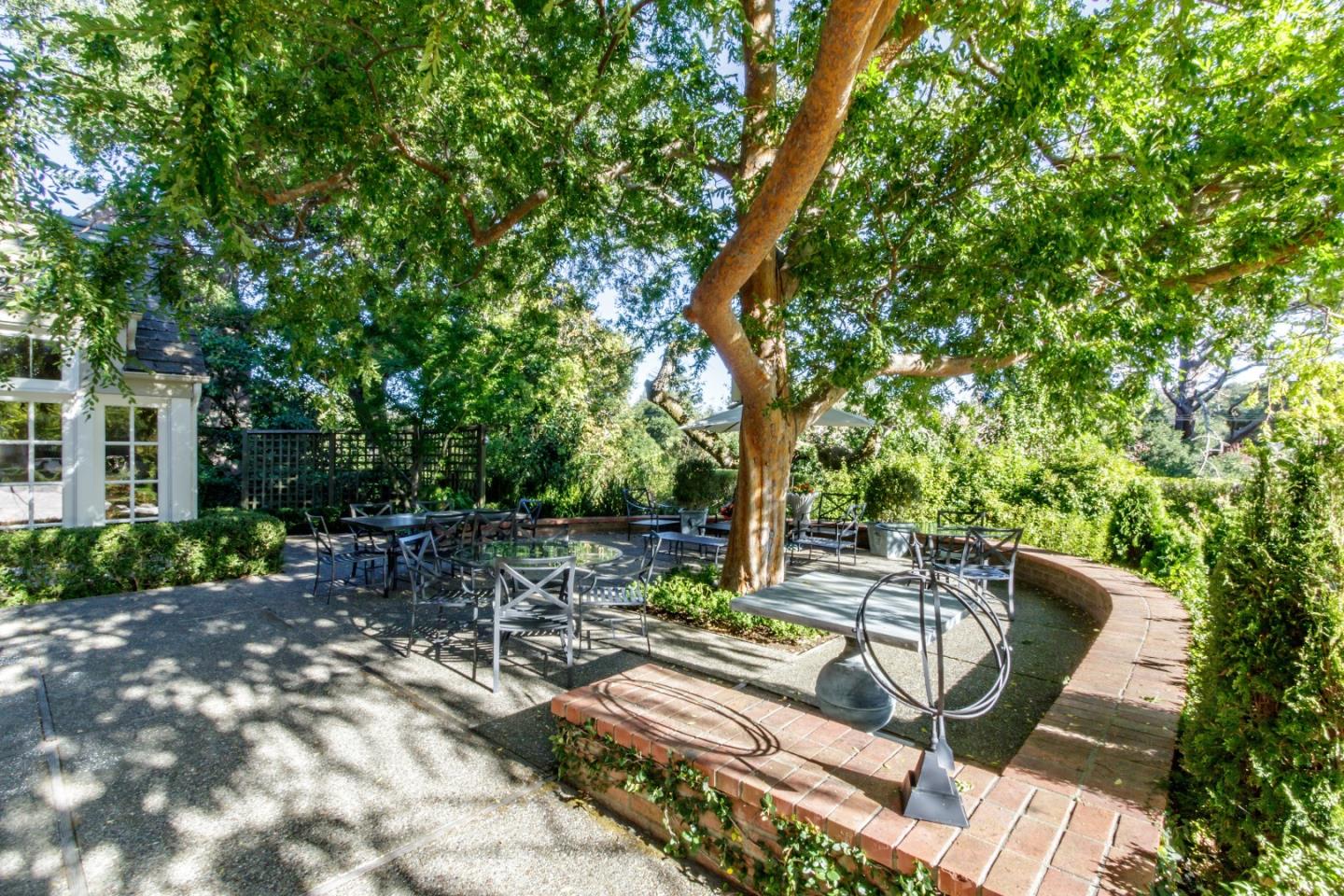 290 Richmond Road Hillsborough, CA 94010 - Photo 20 of 24 a view of a patio with table and chairs and potted plants