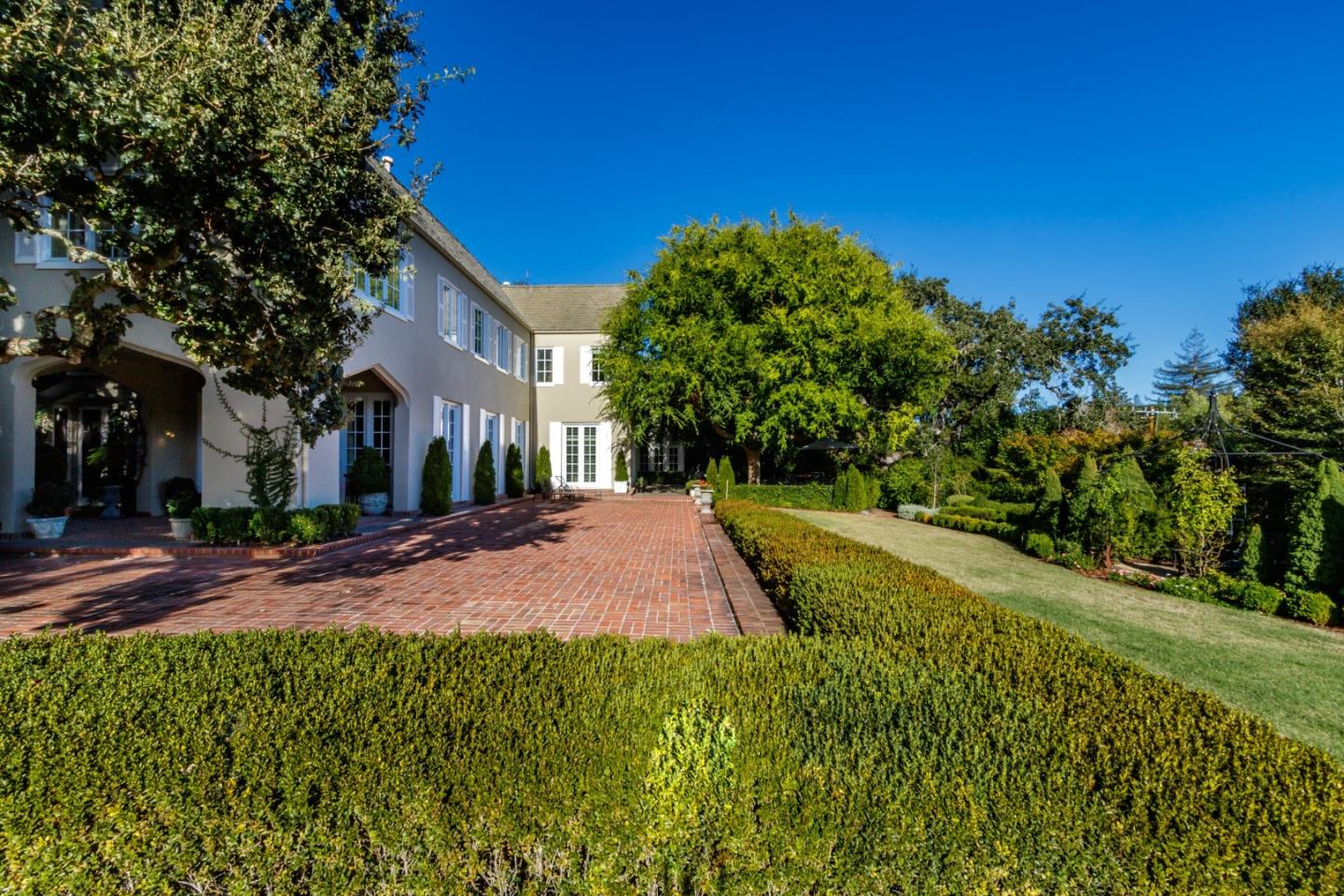 290 Richmond Road Hillsborough, CA 94010 - Photo 21 of 24 a view of a yard with plants and trees
