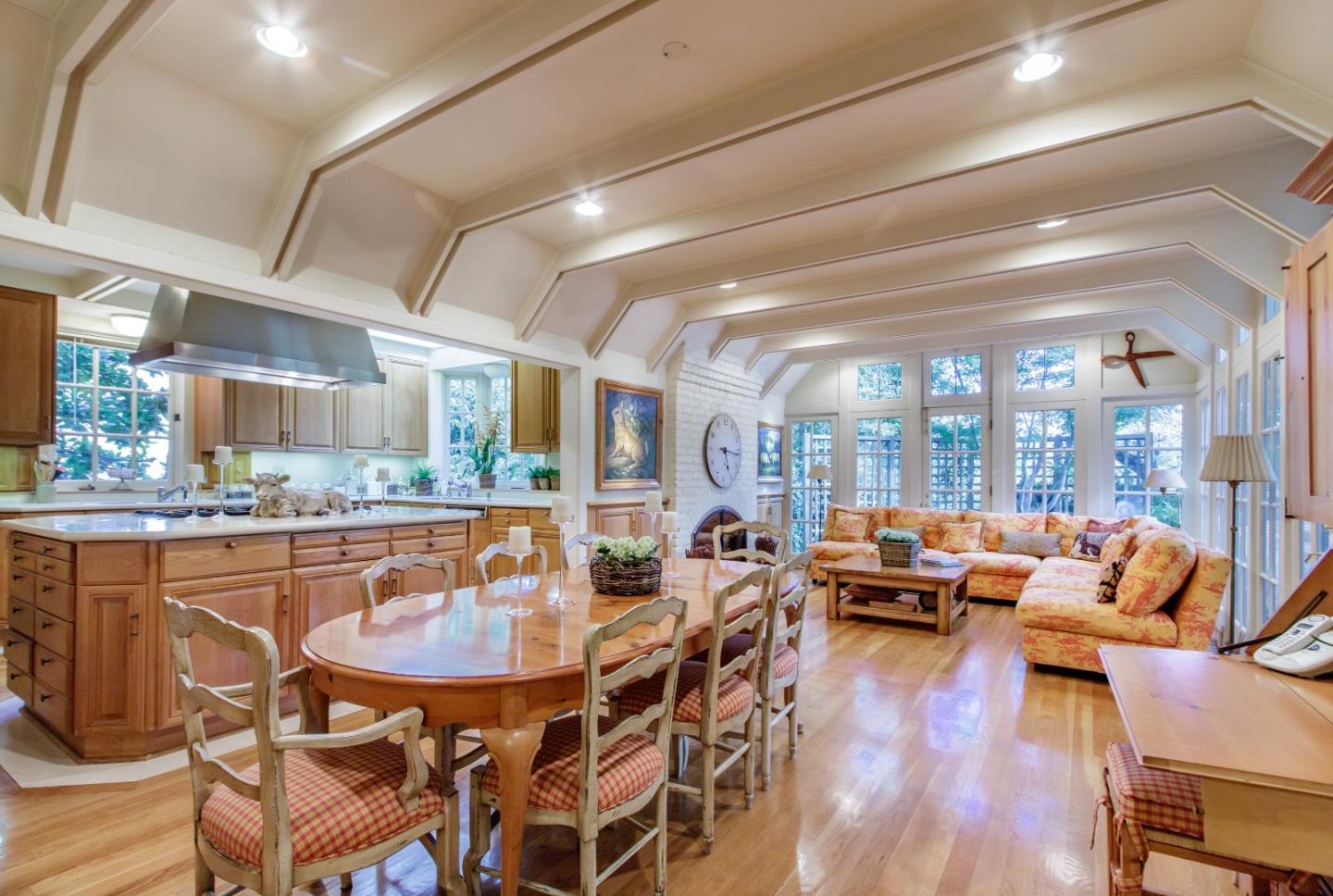 290 Richmond Road Hillsborough, CA 94010 - Photo 7 of 24 a view of a dining room with furniture wooden floor and a chandelier