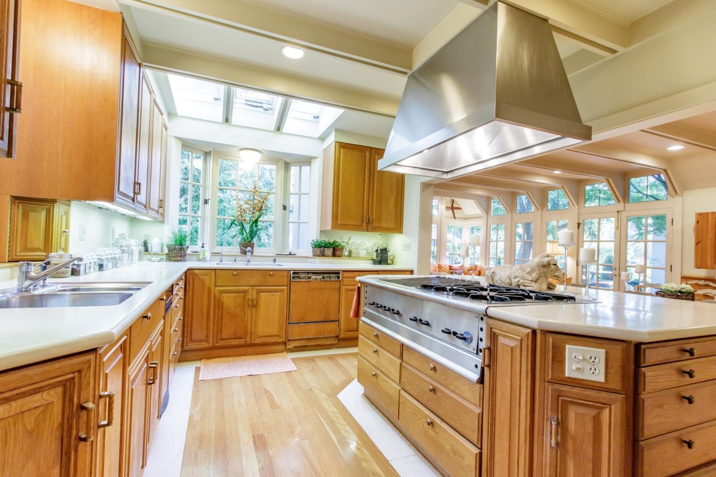 290 Richmond Road Hillsborough, CA 94010 - Photo 8 of 24 a kitchen with stainless steel appliances granite countertop sink stove and cabinets