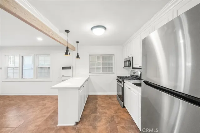 a bathroom with a granite countertop toilet sink and mirror