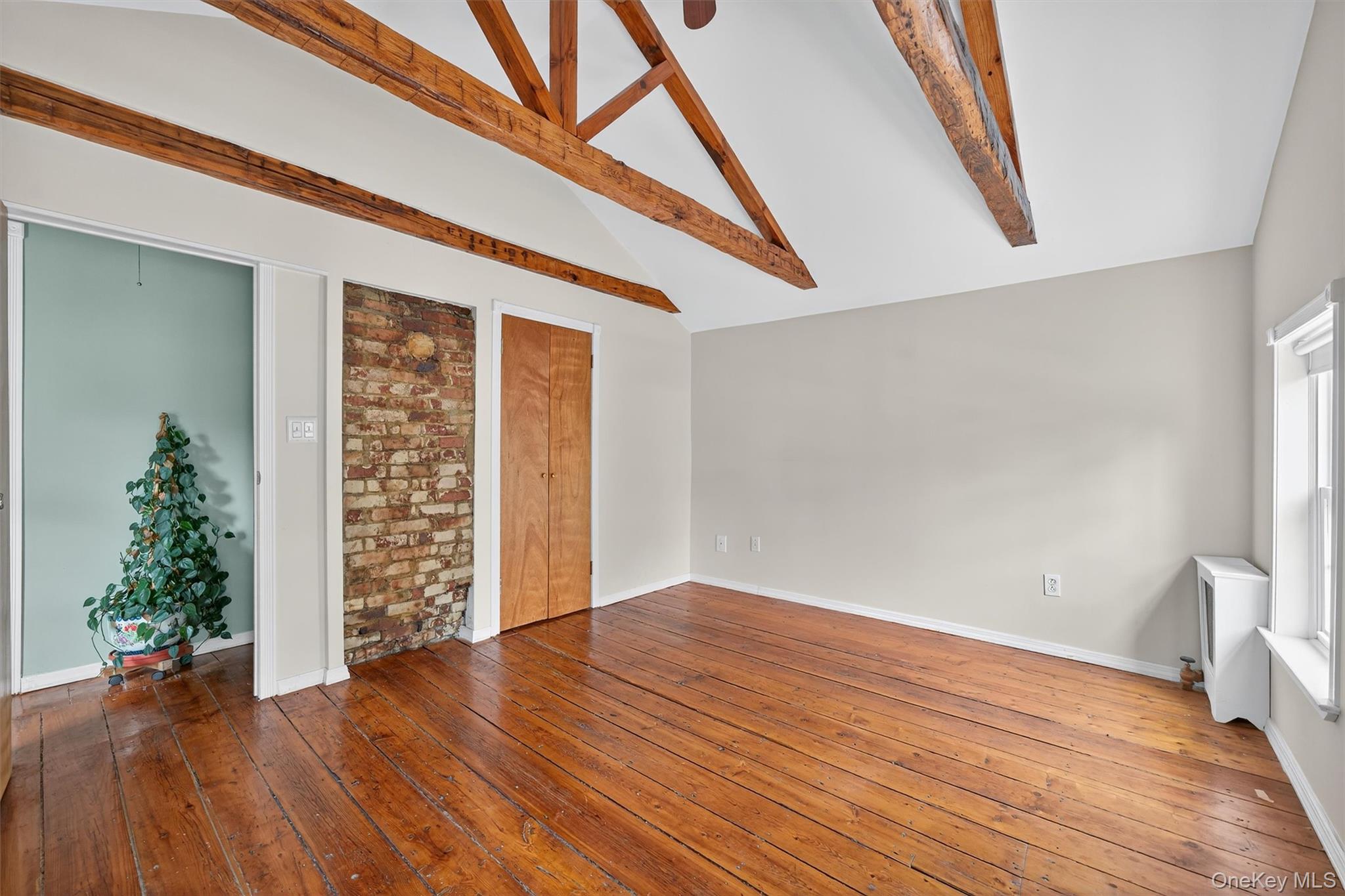 157 Stage Road Monroe, NY 10950 - Photo 16 of 23 wooden floor in an empty room with a window
