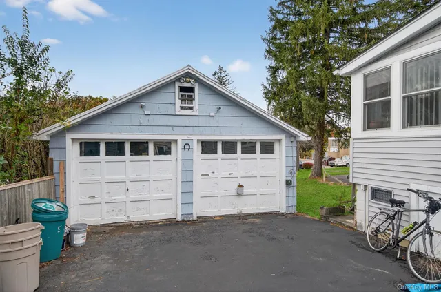 a view of a house with a yard and sitting area