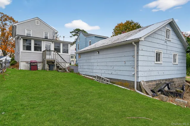 a view of a house with a street