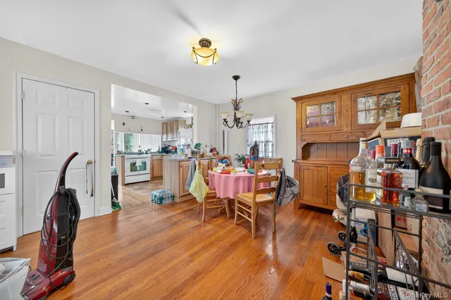 a living room with lots of furniture and a chandelier