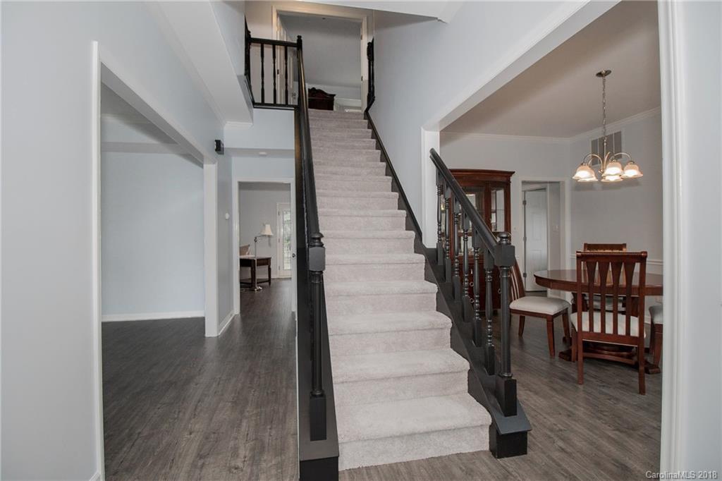 9331 Marshbrooke Road Charlotte, NC 28105 - Photo 2 of 20 a view of entryway and hall with wooden floor