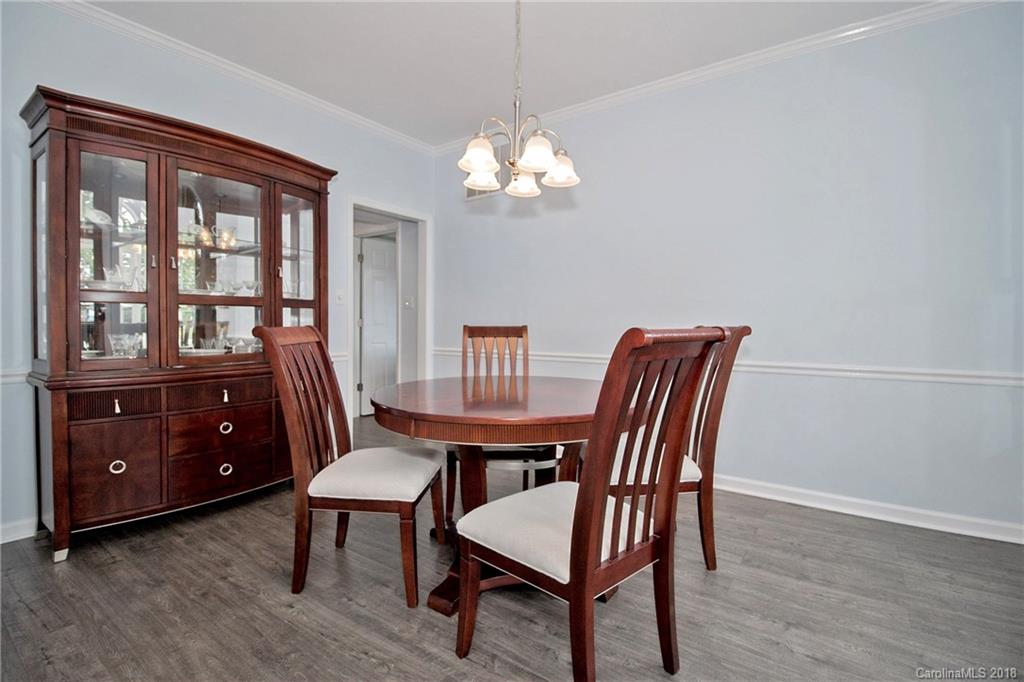 9331 Marshbrooke Road Charlotte, NC 28105 - Photo 3 of 20 a view of a dining room with furniture window and wooden floor