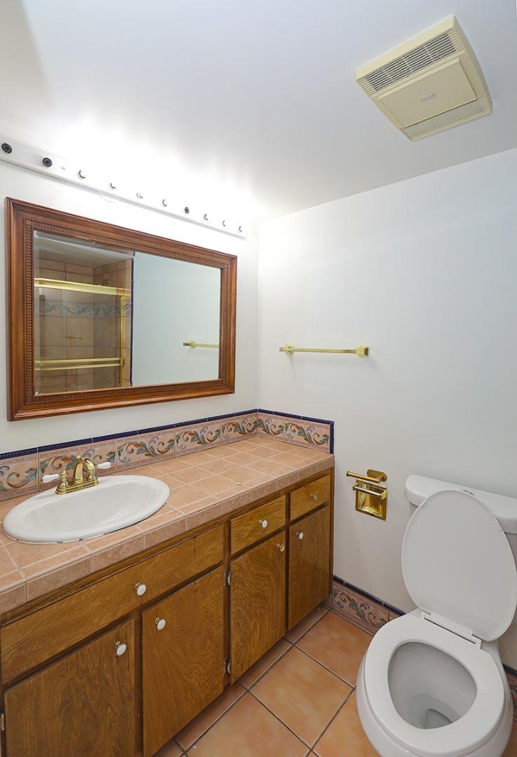 270 Beachview Avenue, Unit 14 Pacifica, CA 94044 - Photo 19 of 41 a bathroom with a toilet sink and mirror