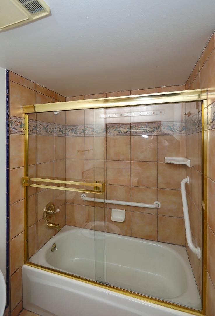 270 Beachview Avenue, Unit 14 Pacifica, CA 94044 - Photo 20 of 41 a bathroom with a shower and a bath tub