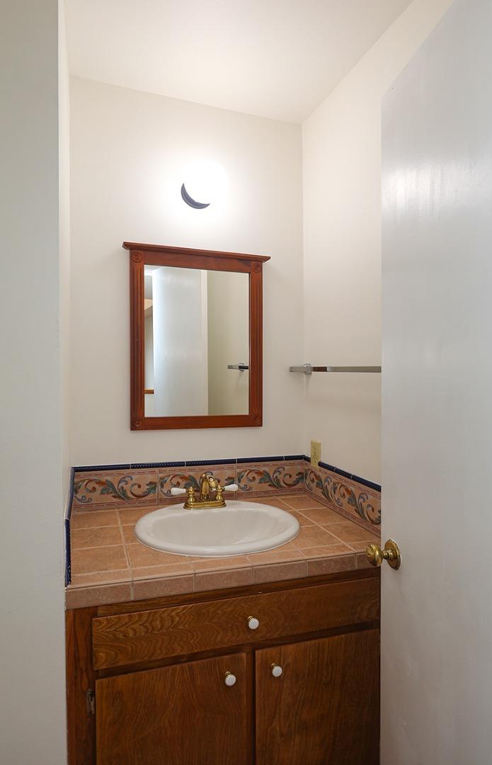 270 Beachview Avenue, Unit 14 Pacifica, CA 94044 - Photo 28 of 41 a bathroom with a sink and a mirror
