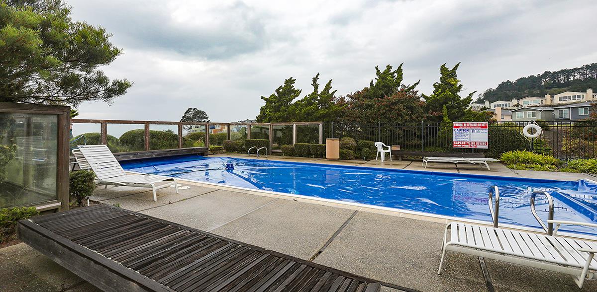 270 Beachview Avenue, Unit 14 Pacifica, CA 94044 - Photo 40 of 41 a view of a balcony with wooden floor and outdoor seating
