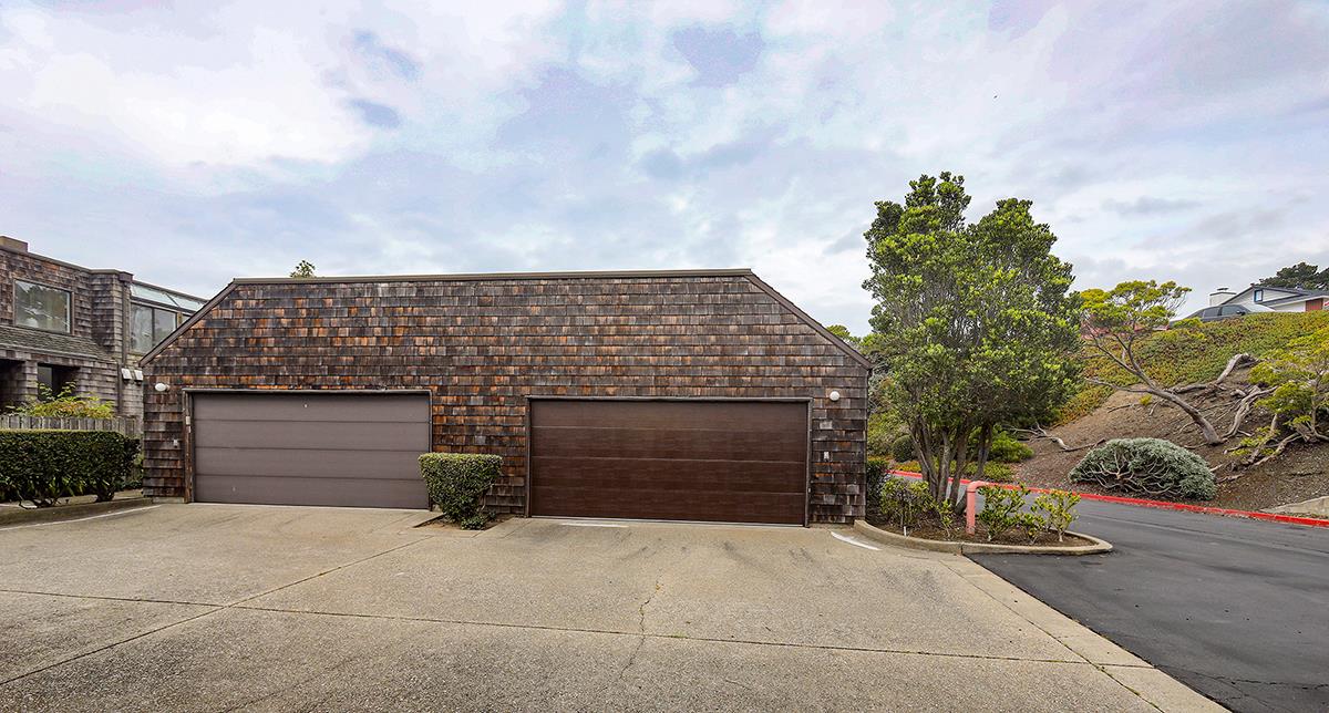 270 Beachview Avenue, Unit 14 Pacifica, CA 94044 - Photo 9 of 41 a front view of a house with a garage
