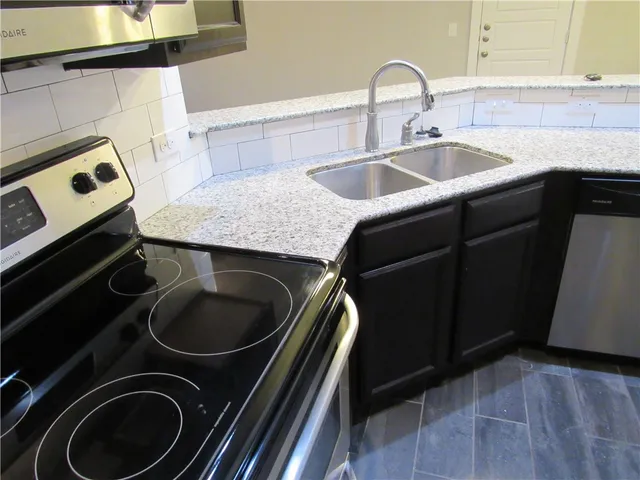 a white toilet sitting next to a bath tub