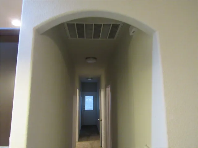 a view of a bathroom from a hallway