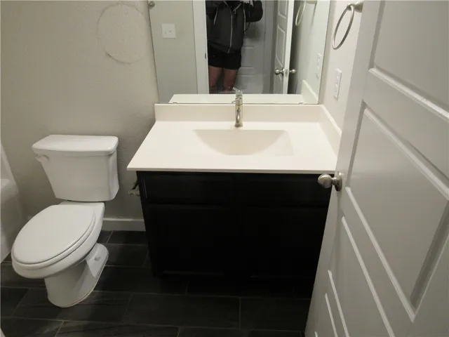 a bathroom with a sink and mirror