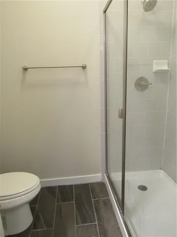 a view of a house with a yard and a forest