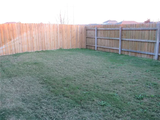 a view of a kitchen from the hallway