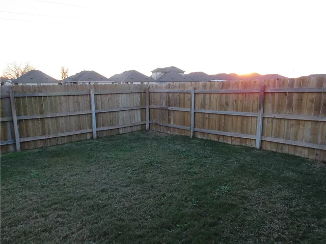 a kitchen with stainless steel appliances a refrigerator and microwave