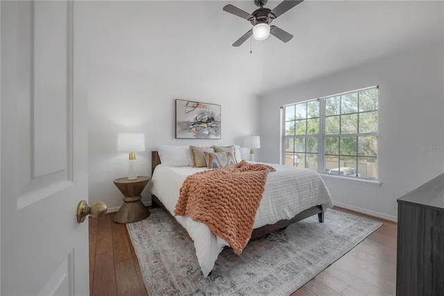 a bedroom with a bed and window