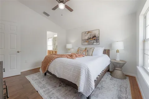 a bedroom with a bed and window