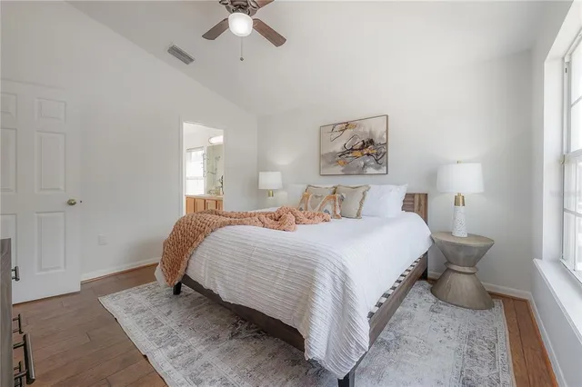 a bedroom with a bed and window