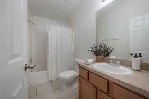 a bathroom with a sink toilet and vanity