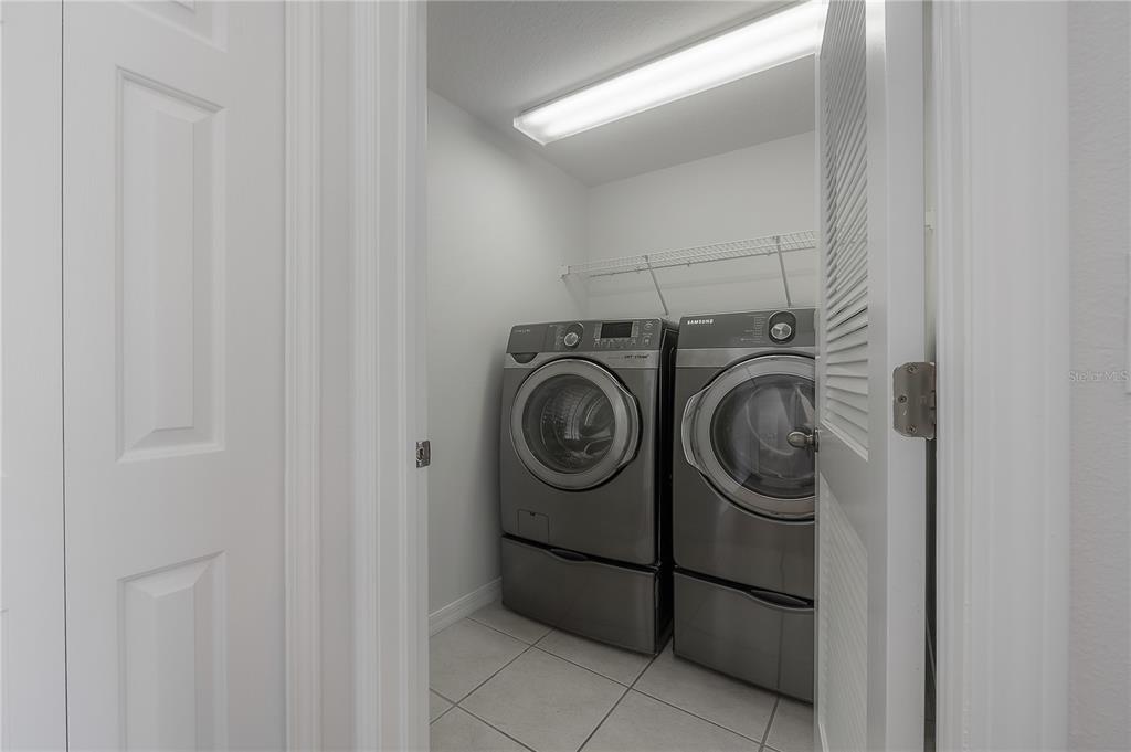 27834 Pleasure Ride Loop Wesley Chapel, FL 33544 - Photo 22 of 25 a utility room with dryer and washer