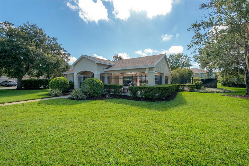 27834 Pleasure Ride Loop Wesley Chapel, FL 33544 - Photo 24 of 25 a front view of a house with a garden