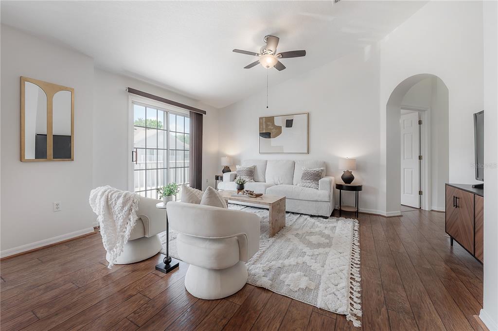 27834 Pleasure Ride Loop Wesley Chapel, FL 33544 - Photo 6 of 25 a living room with furniture and wooden floor